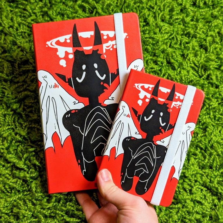 A large and small Angel of Blood sketchbook.