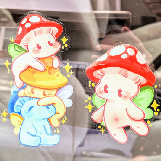 Two Mushroom Fairies window stickers on car window