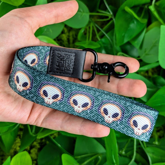 Skeleton Cade wrist lanyard in Milky's hand