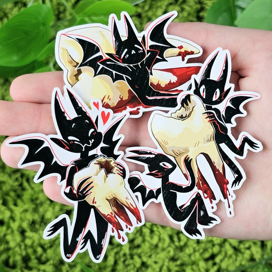 Three Teeth Demon stickers in Milky's hand