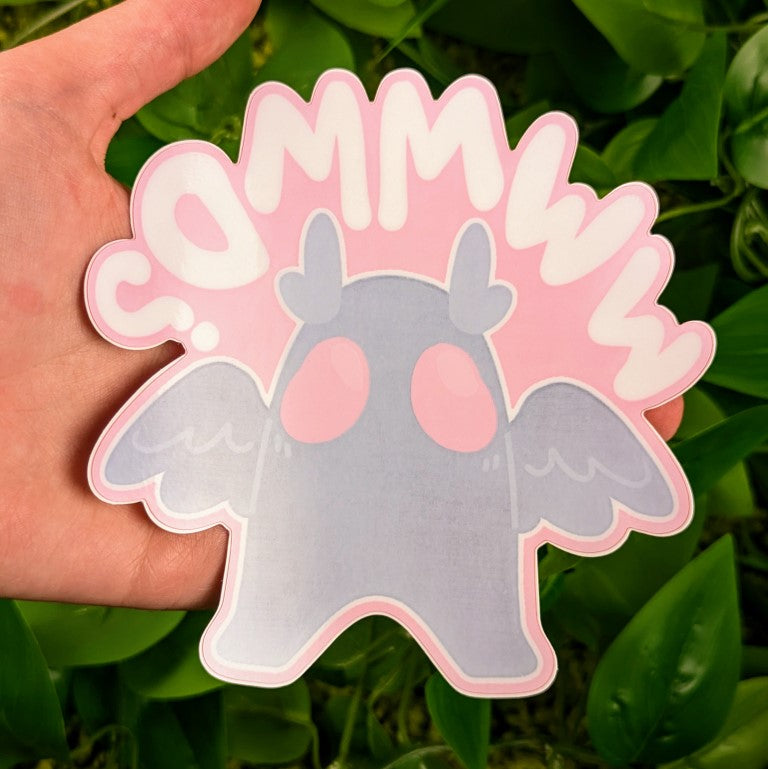 Mothman window sticker in Milky's hand